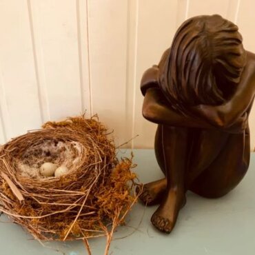 Expressive Arts Retreat - girl figurine with eggs in nest